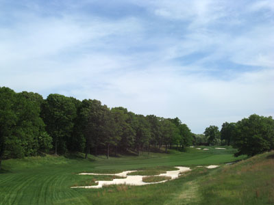 A double dogleg par four with a sloping fairway and elevated green are excellent elements on this par four