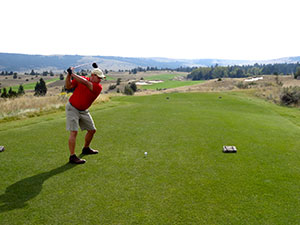 Taking a big swing at the lengthy 10th hole at Rock Creek Cattle Company