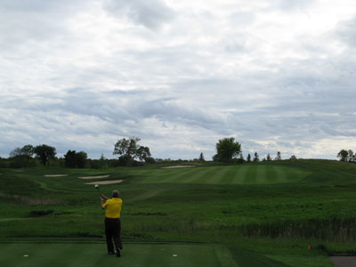 11th hole at Windsong Farm travels up and to the left