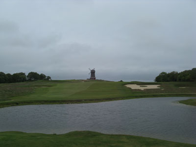 The historic windmill rests beyond the 16th green