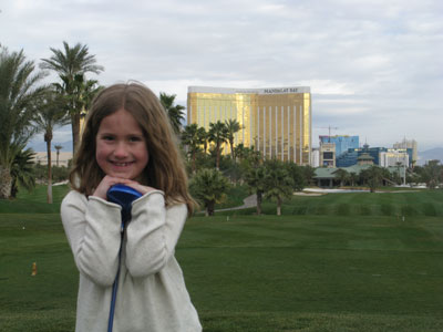 Despite being cold, Shayla manages a big smile on the 18th hole